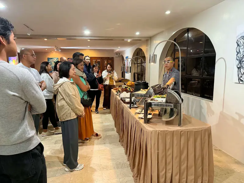 Guests lining up at a buffet spread during an event at Inn-tayon