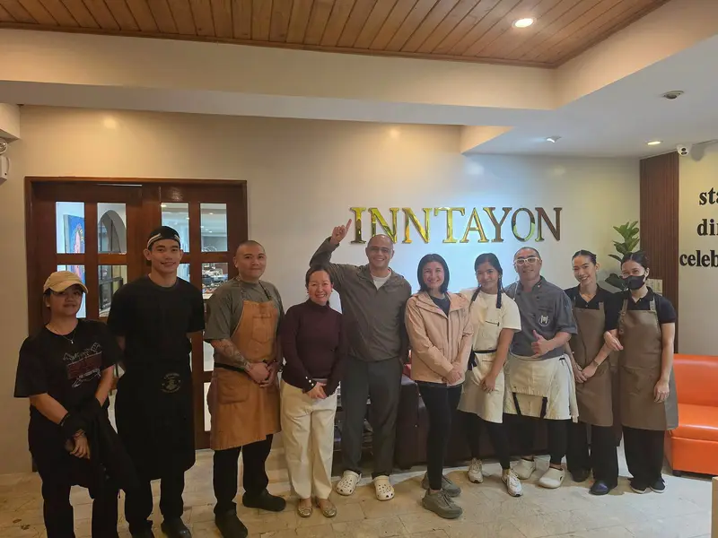 The Inn-tayon team smiling together in the lobby